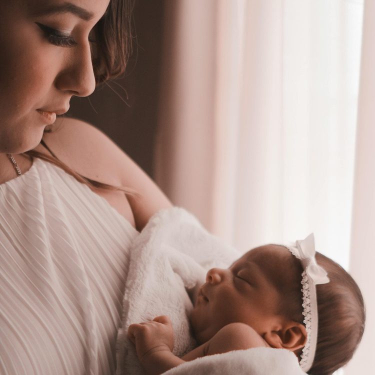 Mom holder her infant baby | 12 Weeks Baby Development | Mary's Refuge, Martinsburg WV